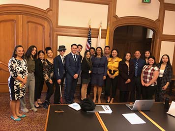 Graduate student fellows in City Hall with Mayor Breed