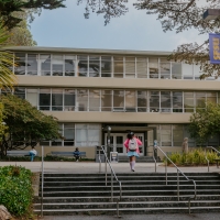 A student walking to the HSS building